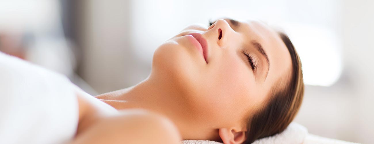 Reclining, relaxed woman is ready for a spa treatment