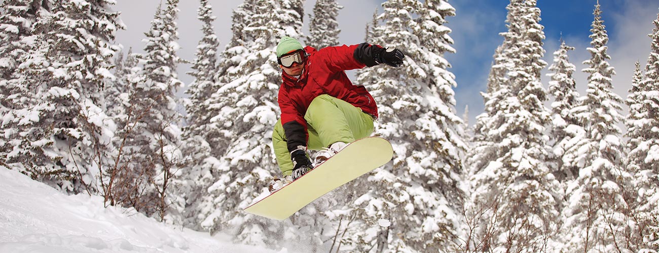 A snowboarder jumping